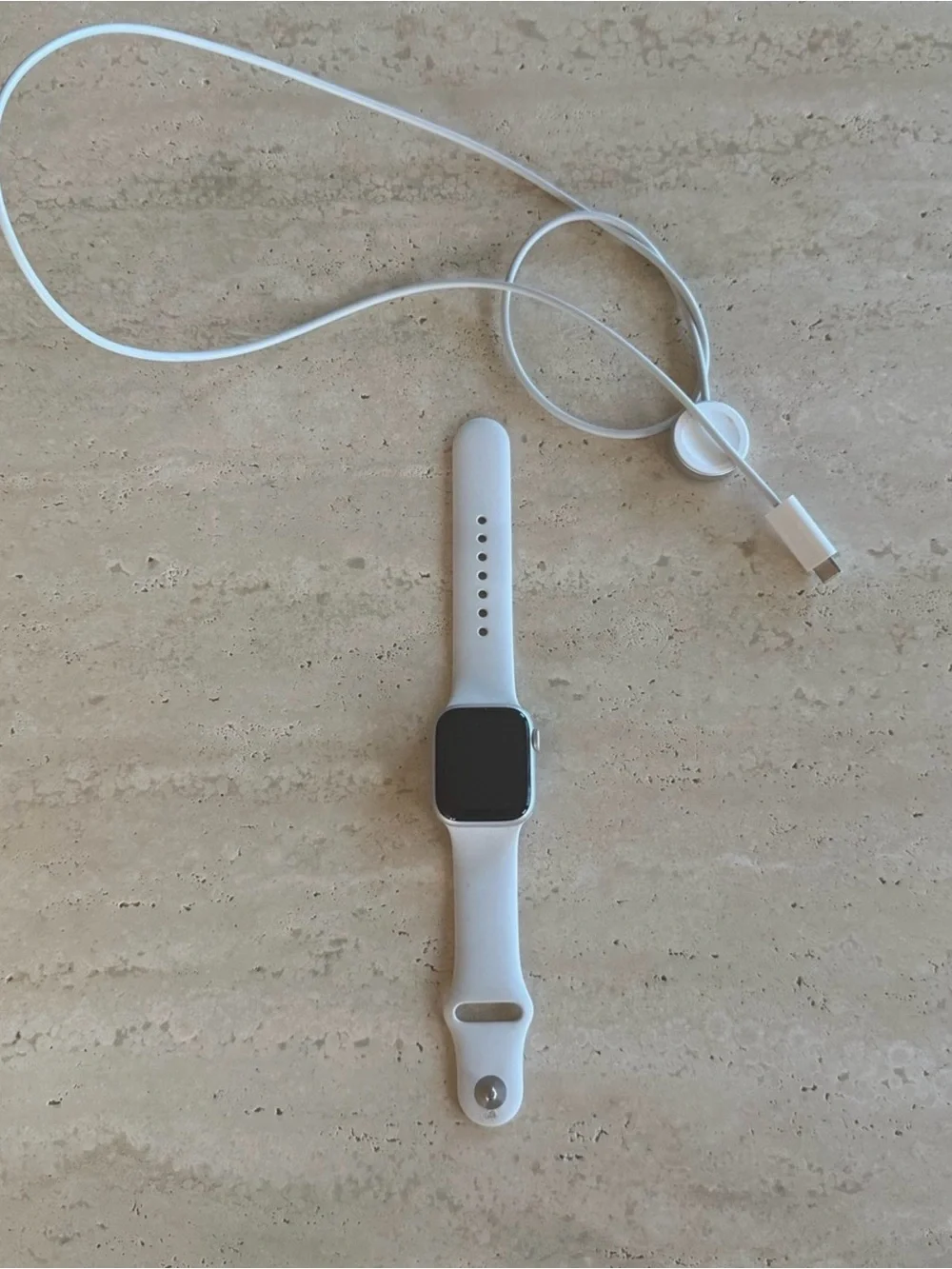 Apple Watch Series 8 with charging cord